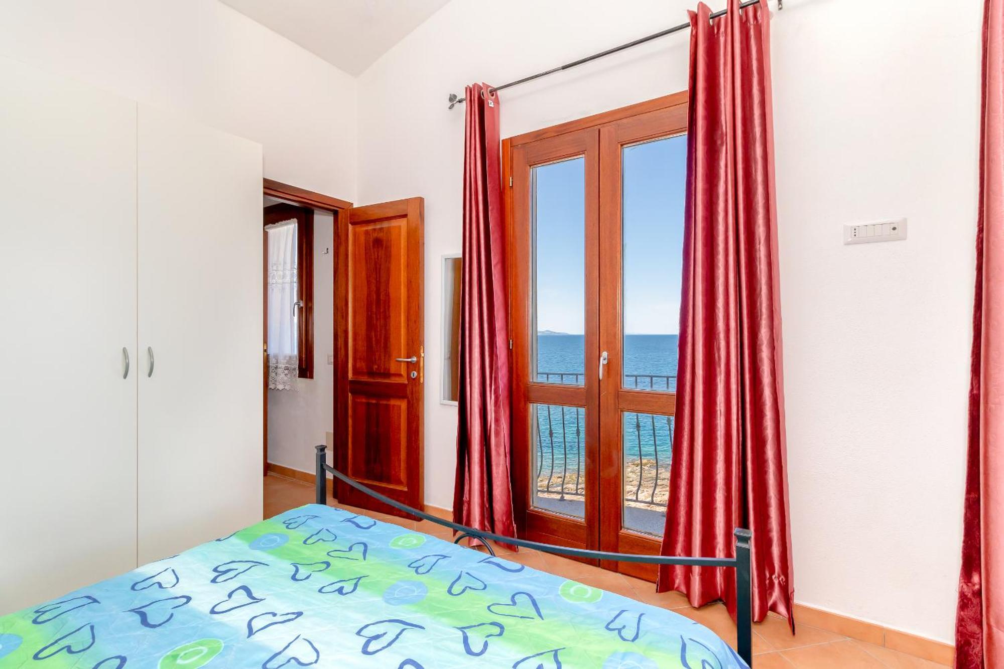 Casa Sulla Scogliera Isola Rossa Apartment Luaran gambar